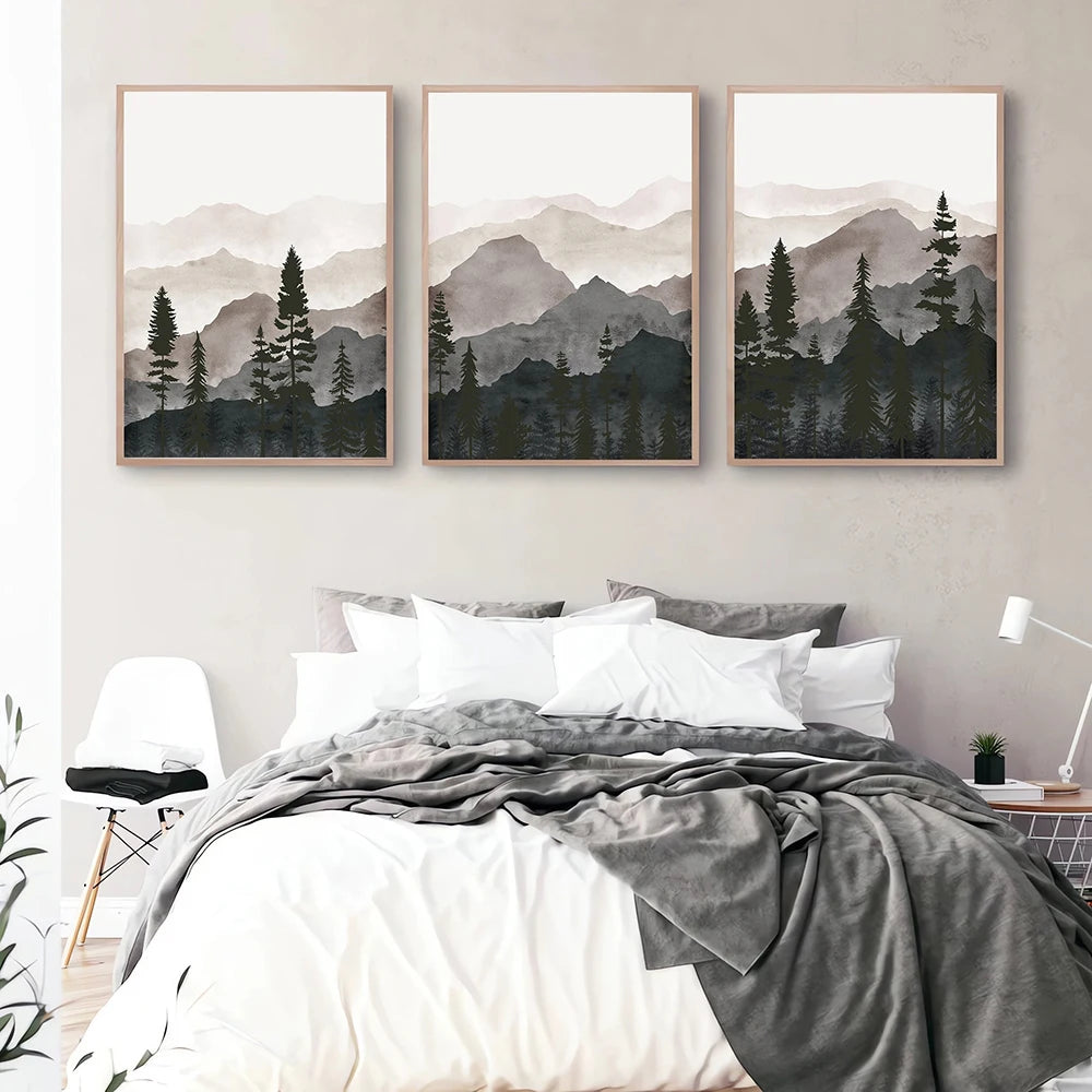 3 canvas prints of a misty forest in a watercolour style - hung in a bedroom