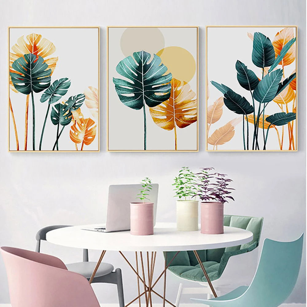 Set of 3 botanical canvas prints mounted on a white dining room platform.